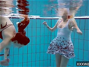 sizzling Russian gals swimming in the pool